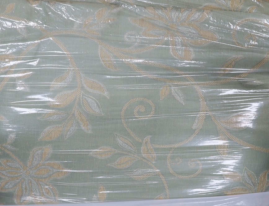 A set of 4 pale green, silver thread brocade curtains with an overall floral vine design woven in cream throughout, together with a pair of corded and tasseled tie backs.